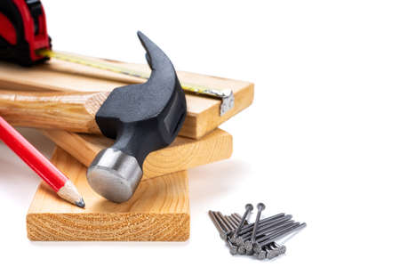Close-up of hammer and carpenter's tools on a white background. Construction industry, do it yourself. Text space.の写真素材