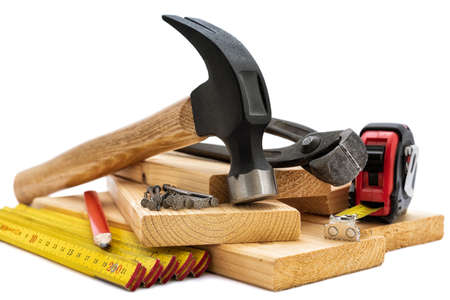 Close-up of hammer and carpenter's tools on a white background. Construction industry, do it yourself. の写真素材