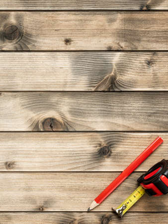 Top view of carpenter work tools on an antique wooden table. Construction industry, do it yourself. Text space.の写真素材