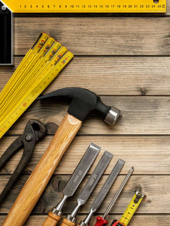Top view of carpenter work tools on an antique wooden table. Construction industry, do it yourself.の写真素材
