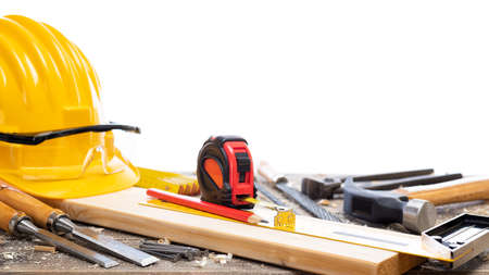 Close-up. Carpenter's workbench  with tools for woodworking. Construction industry. Isolated on a white background.の写真素材