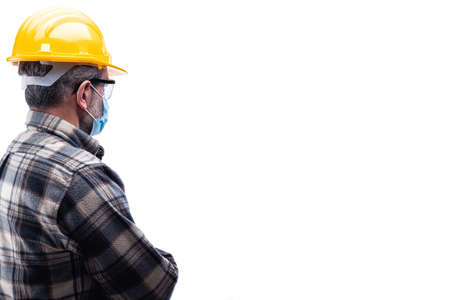 Carpenter worker isolated on white background, wears helmet, goggles, leather gloves and surgical...