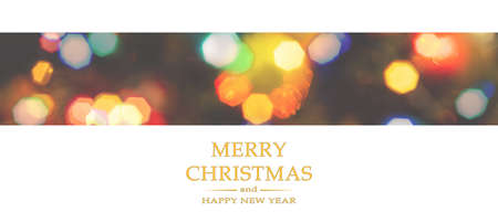 Merry Christmas and Happy New Year greeting card, blurred background of the twinkling lights of the Christmas tree. Greeting card background.の写真素材