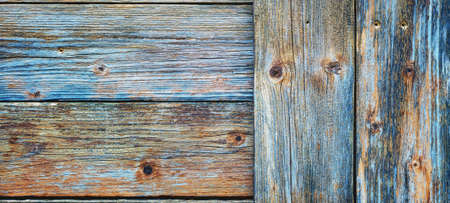 Texture of the planks of an old wooden table in antiqued pastel colors. Vintage rustic wooden background. Carpentry.の写真素材