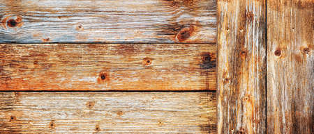 Texture of the planks of an old wooden table in antiqued pastel colors. Vintage rustic wooden background. Carpentry.の写真素材