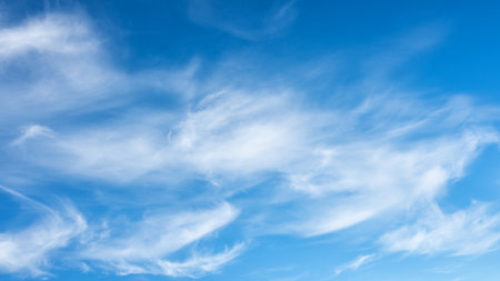 Landscape of a beautiful blue sky covered with cumulonimbus clouds on a winter afternoon. Unspoiled nature.の写真素材