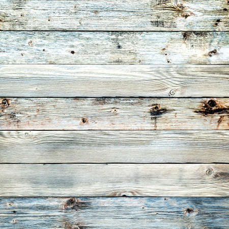 Texture of the planks of an old wooden table in antiqued light pastel colors. Vintage rustic wooden background. Carpentry.の写真素材