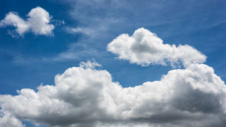 Landscape of a beautiful blue sky covered with cumulonimbus clouds on a winter afternoon. Unspoiled nature.の写真素材