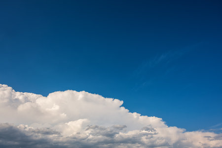 Landscape of a beautiful blue sky covered with cumulonimbus clouds on a summer afternoon. Unspoiled nature.の写真素材