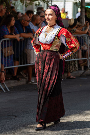 Nuoro, Sardinia, Italy - August 27, 2023: Parade of traditional costumes of Sardinia on the occasion of the Feast of the Redeemer of the August 27, 2023 in Nuoro, Sardinia.のeditorial素材