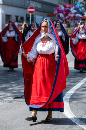 Nuoro, Sardinia, Italy - August 27, 2023: Parade of traditional costumes of Sardinia on the occasion of the Feast of the Redeemer of the August 27, 2023 in Nuoro, Sardinia.のeditorial素材