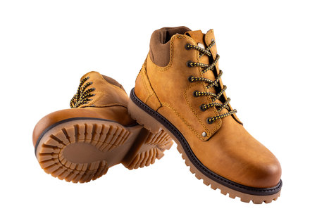 Close up of winter boots in natural nubuck leather for adult men photographed on a white background. Fashion accessories.の写真素材