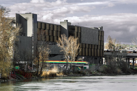 Wien, Ostrich - 30 MARCH 2018: Scenic view of austrian cityscape and graffiti from a touristic ferry on Danube River during winter, Wien, Austriaのeditorial素材