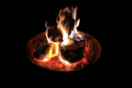 Isolated burning fire in bronze brazierの写真素材