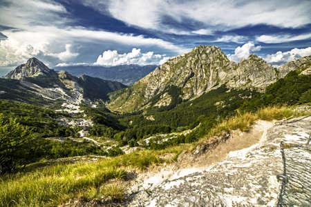 Scenic wide angle view of Apuan alps with Mountain Pizzo D'Uccello and valley during summer, Minucciano Lucca, Val Serenaia, Tuscany, Italyの写真素材