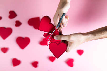Guy prepares Red Heart with paper for valentines dayの写真素材