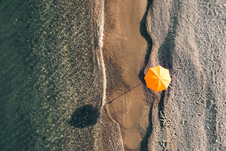 Beach umbrella on white sandの写真素材