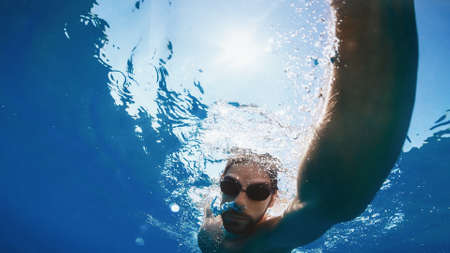 Freestyle swim in the ocean. Underwater viewの写真素材