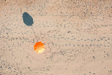 Beach umbrella at sunset lightの写真素材