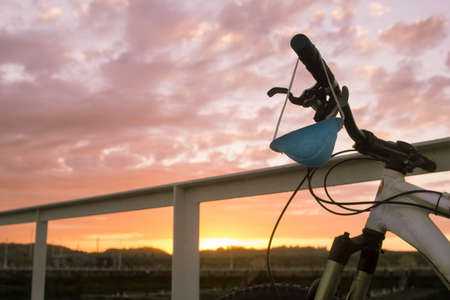 face mask hanging on a bicycle