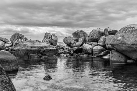 Rocks in Insuela, Palmeira, in the city of Riveira, Galicia (Spain), in the august morning cloudy day in the beautiful Ria de Arousa. Photo was taken walking with my younger son, so future is here!の写真素材