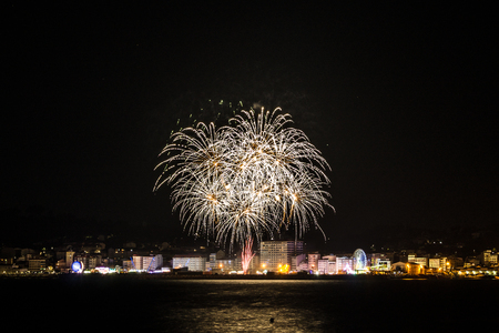 Summer fireworks in Riveira, Galicia. Long exposure shot from Coroso beach.の写真素材