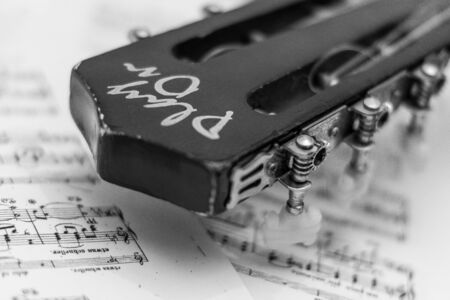 Composition, guitar and detail of music sheetの写真素材