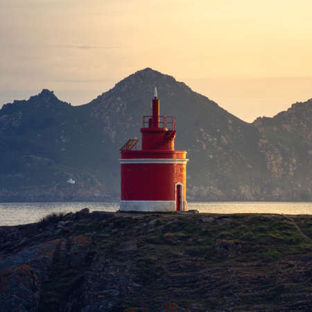 Iconic red lighthouse in Punta Robaleira, in Cabo Home, Cangas, Spainの写真素材