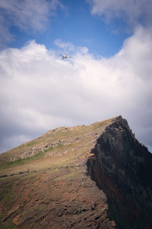 Helicopter flying over the mountainsの写真素材
