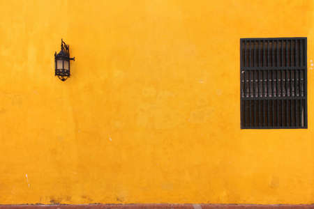 Lamp, window and orange wallの写真素材