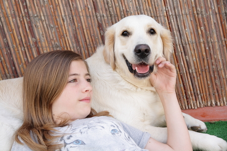 RELAXED GIRL WITH HER DOGの写真素材