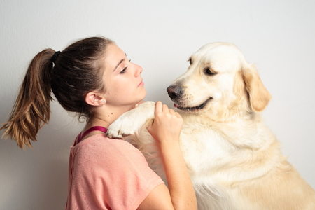 Teen playing with her dog