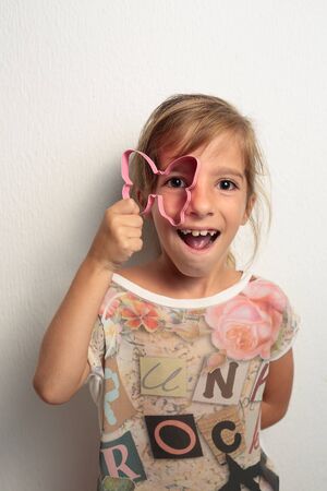girl playing with a cast of Marioposaの写真素材