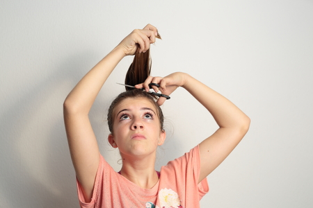 teenager getting a haircutの写真素材