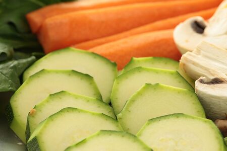 tray with fresh cut vegetables to cookの写真素材