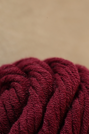 Wool skeins of yarn and knitting needles