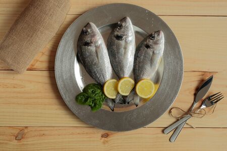 raw fish on wooden tray background silver pineの写真素材