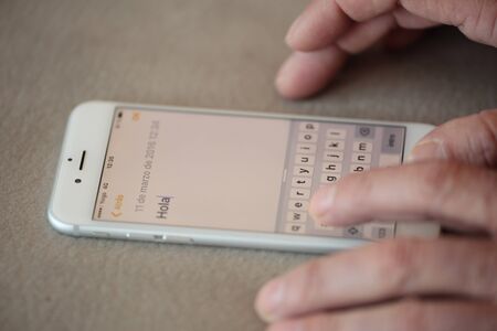 Man chatting with your smartphoneの写真素材