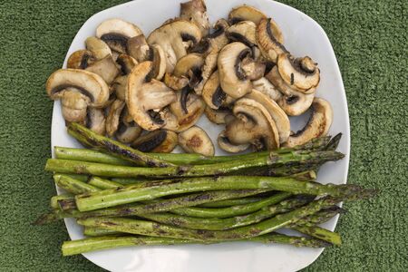Cooked asparagus grilled with olive oil and saltの写真素材