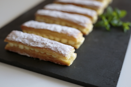Homemade strudel cream on a slate base