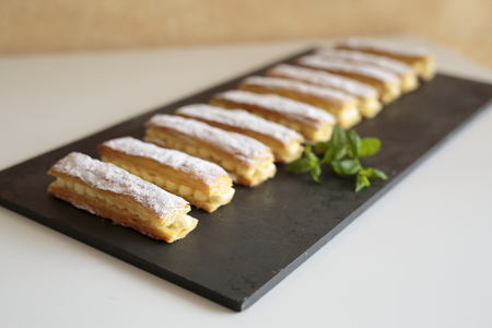 Homemade strudel cream on a slate base
