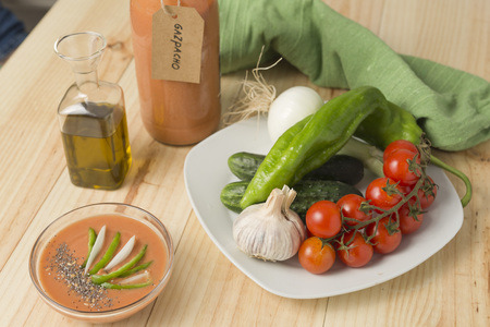 Andalusian gazpacho with ingredients on a wooden background pineの写真素材