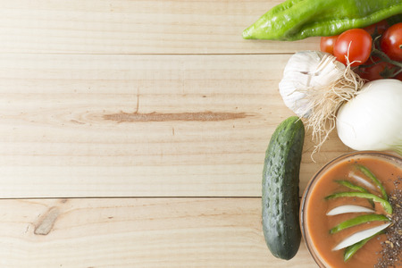 Andalusian gazpacho with ingredients on a wooden background pineの写真素材