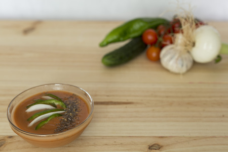 Andalusian gazpacho with ingredients on a wooden background pineの写真素材