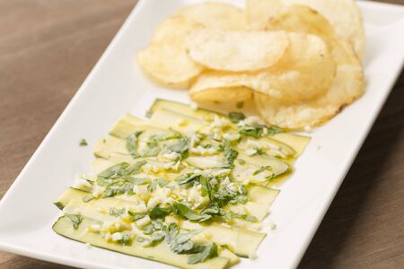 Agrios vegans and chips on a wooden backgroundの写真素材