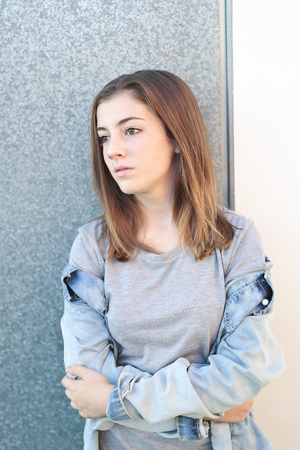 Teenager thoughtful with light natural and takes vertical.の写真素材