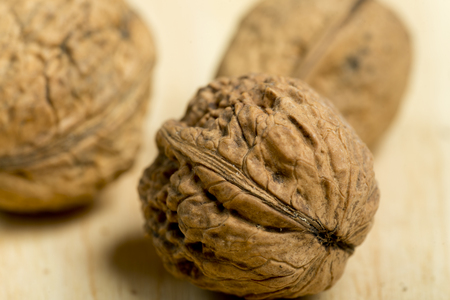 Nuts on a pine wood background. Artificial lighting with flax.の写真素材