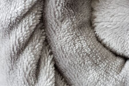 Texture of a rolled up blanket. Horizontal shot with natural lightの写真素材