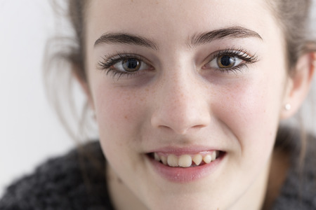 Closeup of young woman smiling. Horizontal shot.の写真素材