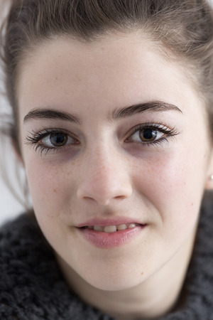 Closeup of young woman smiling. Horizontal shot.の写真素材